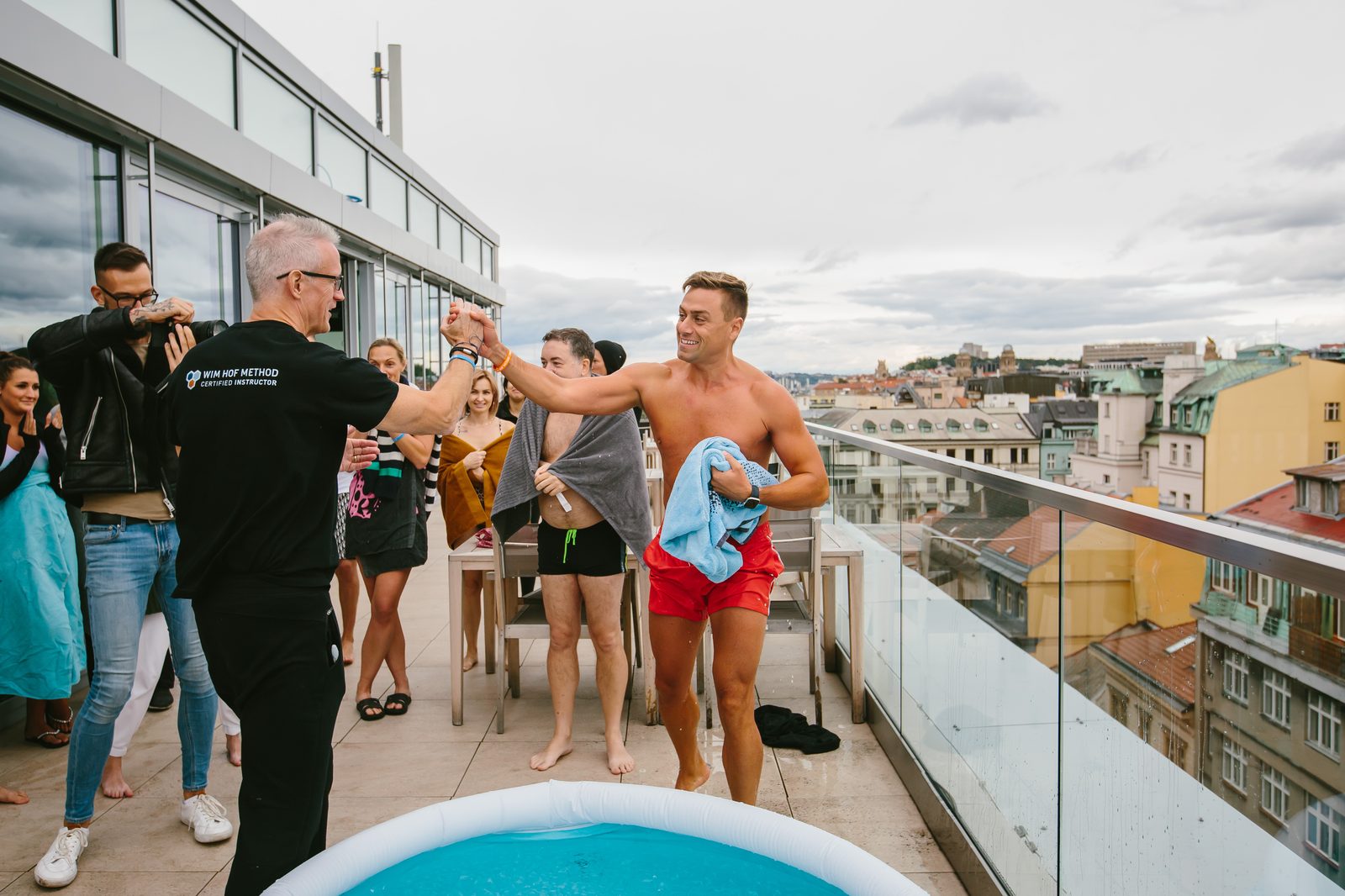 Max Munson leading a Wim Hof Method workshop on a Prague rooftop